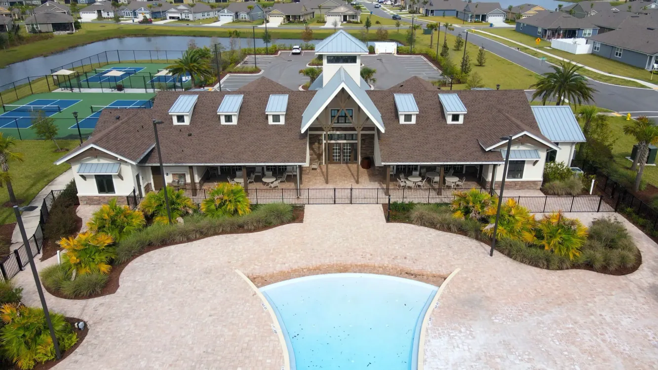 Parkland Preserve amenity center surrounded by pool and sports courts