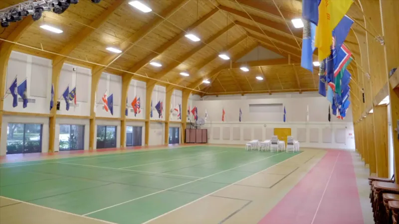 Indoor track surrounding court area.