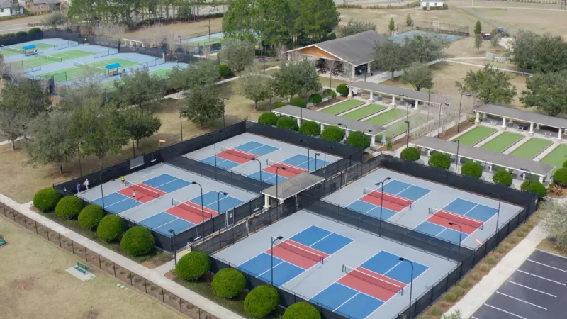 Tennis, pickleball and bocce courts adorned with meticulous landscaping at Del Webb Stone Creek.