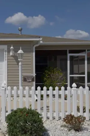 Exterior of a home in The Villages with a white picket fence.
