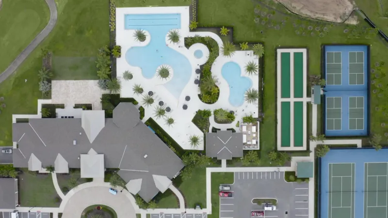 Bird's eye view of clubhouse, pool and sports courts