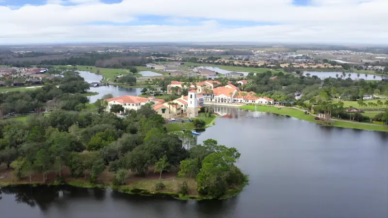 Aerial view of the Solivita community with lakes, homes, and amenities.