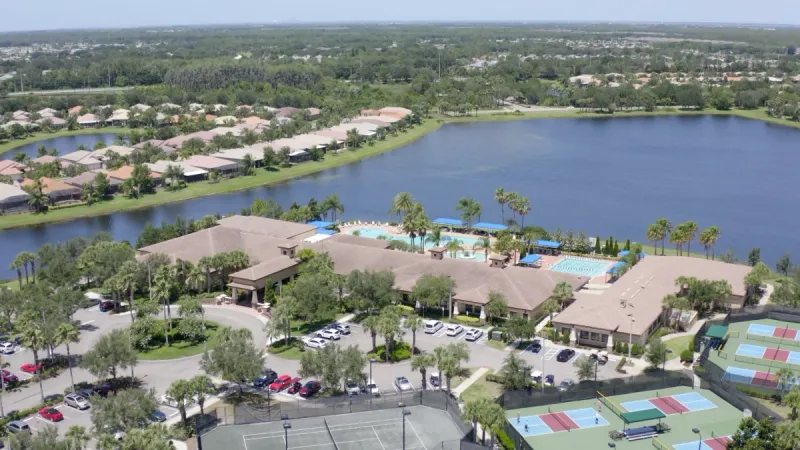 Aerial view of clubhouse, lakes and homes.