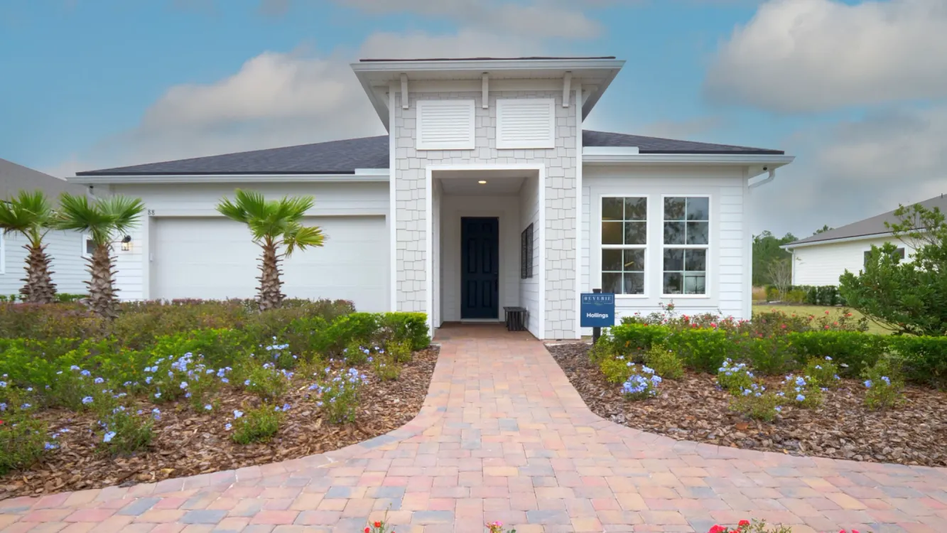 Model home in a Jacksonville FL 55+ community with meticulous landscaping at Reverie at TrailMark
