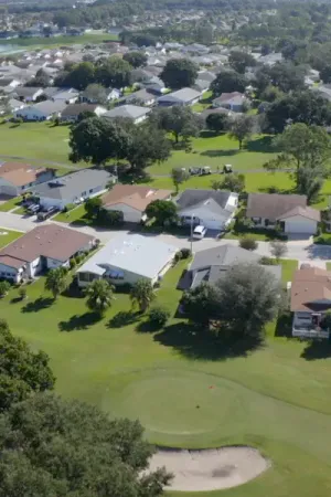 Highland Fairways homes along street backing up to golf course.