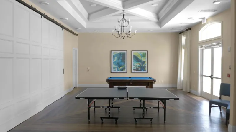 Billiards and ping pong table in game room