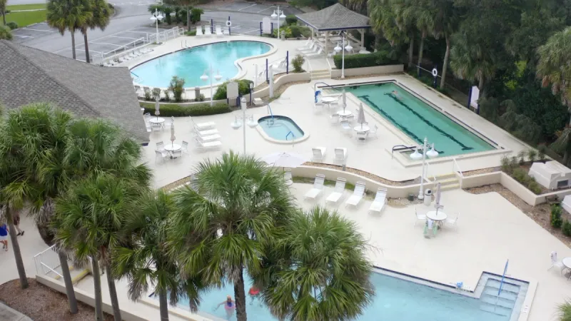 Aerial view of three available pools to swim in.
