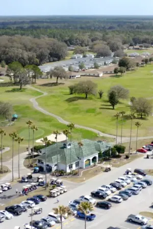 Spruce Creek Preserve golf center and golf greens backing up to homes.