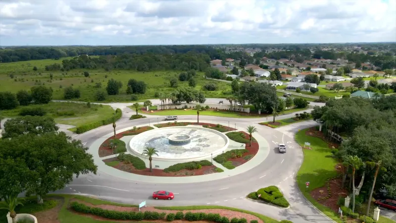 Roundabout with a beautifully landscaped centerpiece in the Spruce Creek Country Club 55+ community