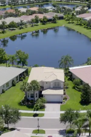 Aerial view of homes overlooking a lake.