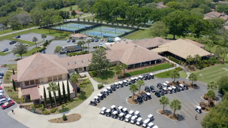 Aerial view of golf carts parked in front of The Villages of Citrus Hills amenity center.