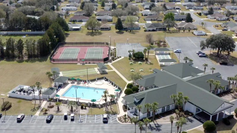 Pool and sports courts behind the Spruce Creek Preserve clubhouse.