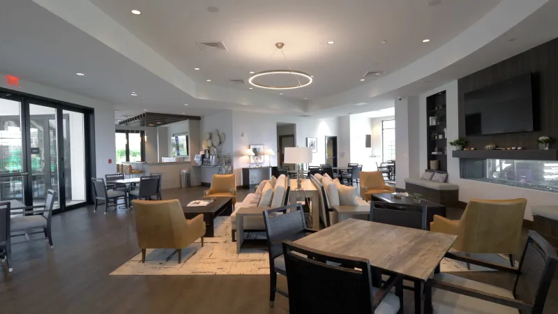Interior of the modern community clubhouse with stylish seating areas.