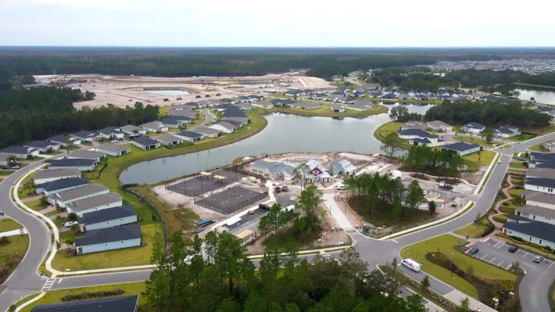Meticulously placed homes with pristine landscaping, water features and homesites ready for construction at Reverie at TrailMark.
