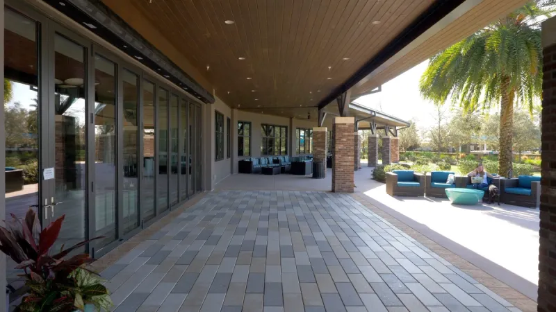 Covered seating areas and walkways at the Ocala Preserve clubhouse.
