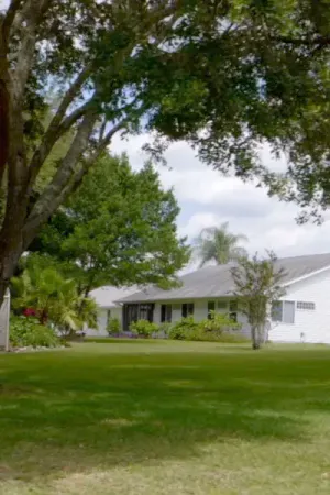 Exterior view of Highland Lakes home with beautiful landscaping.