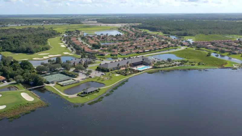 Birdseye view of lakeside community, amenities and golf course.