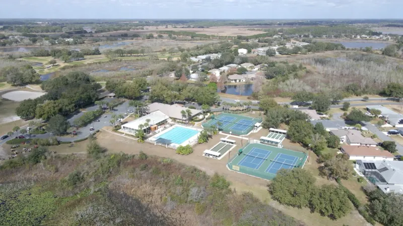Aerial view of the Royal Highlands outdoor amenities amongst homes.