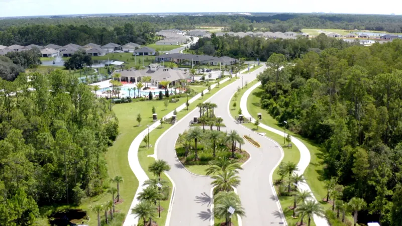 Gated entry at Palms at Serenoa and roadways next to community clubhouse.