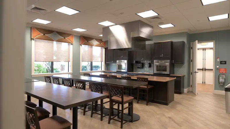 Modern demo kitchen at Valencia Cove with large tables and professional equipment.