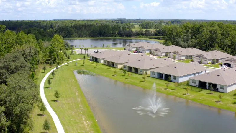 Homes situated along ponds and walkways.