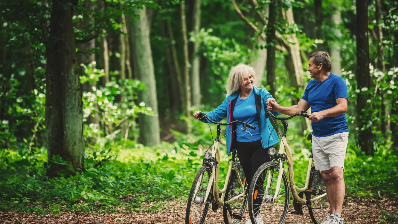 Couple biking in a scenic area.