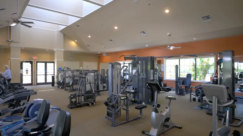 A well-equipped gym with a diverse range of exercise equipment.