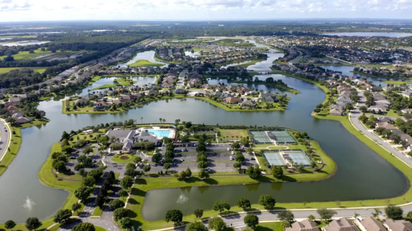 Aerial view of homes surrounded by lakes