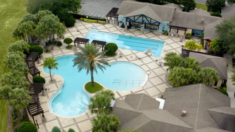 Aerial view of pools, lounge areas and landscaping