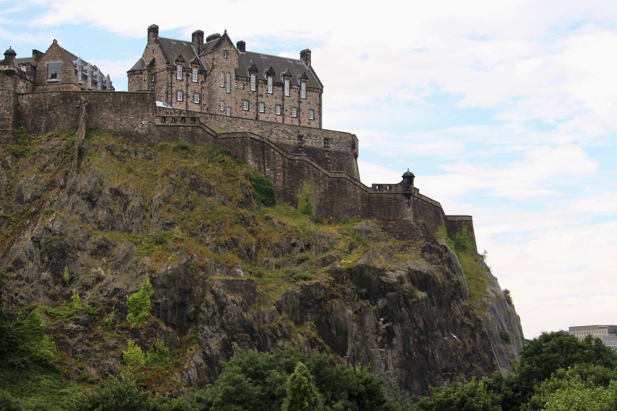 Edinburgh Castle on Castle Rock under a pale sky.