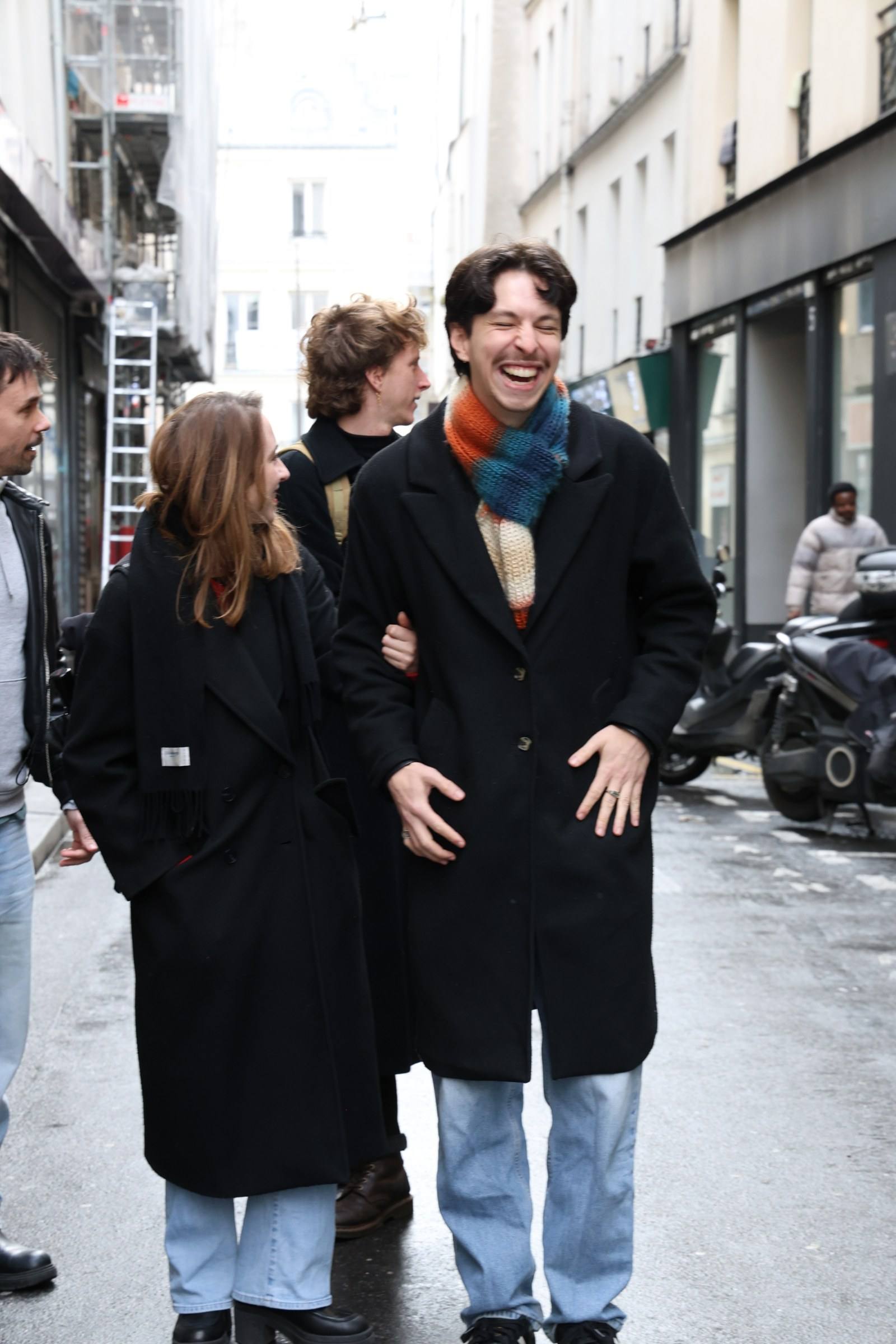 Four people laughing as they walk down a street on a Timeleft walk