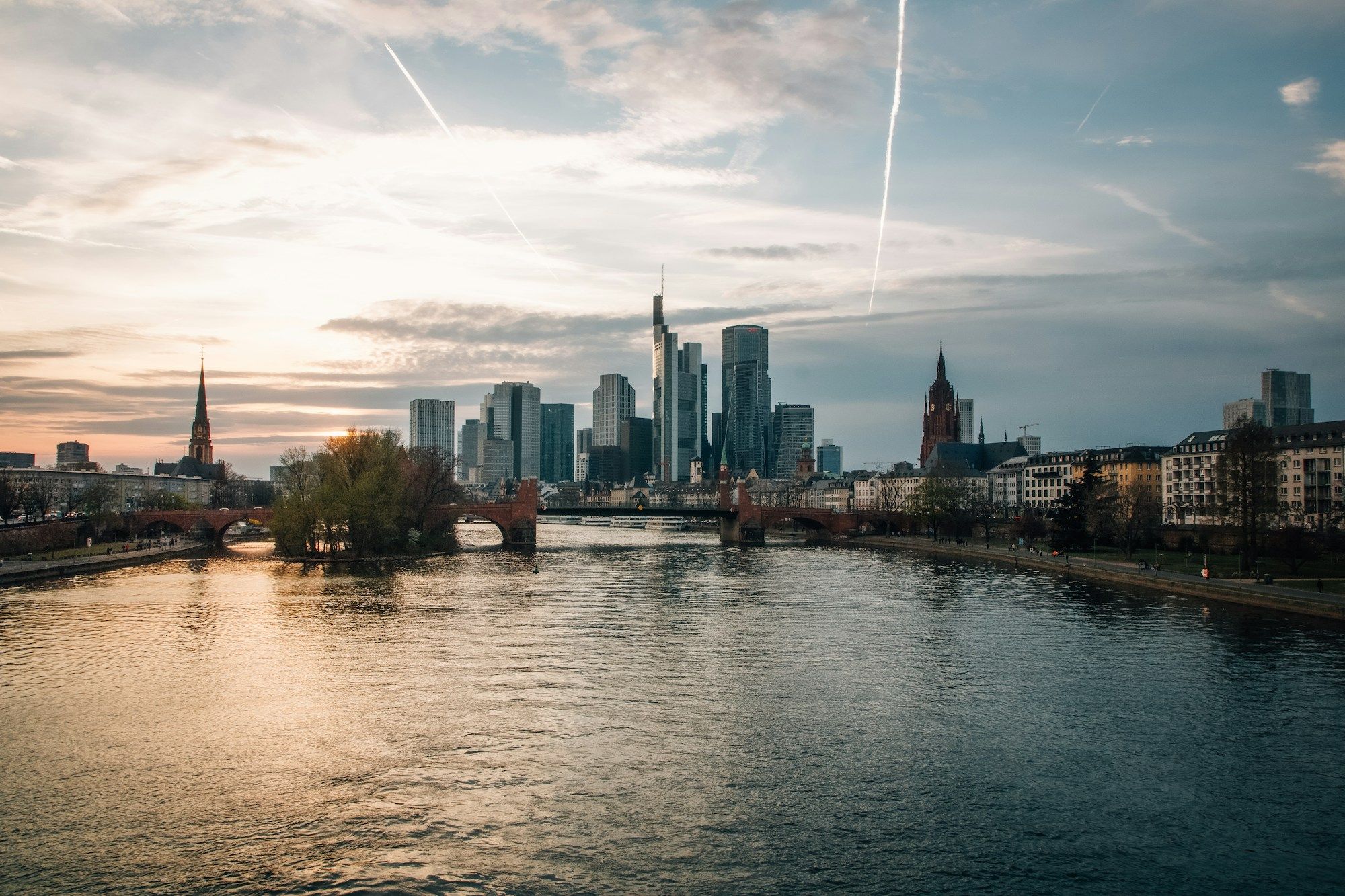 The Frankfurt skyline at sunset across the river Main