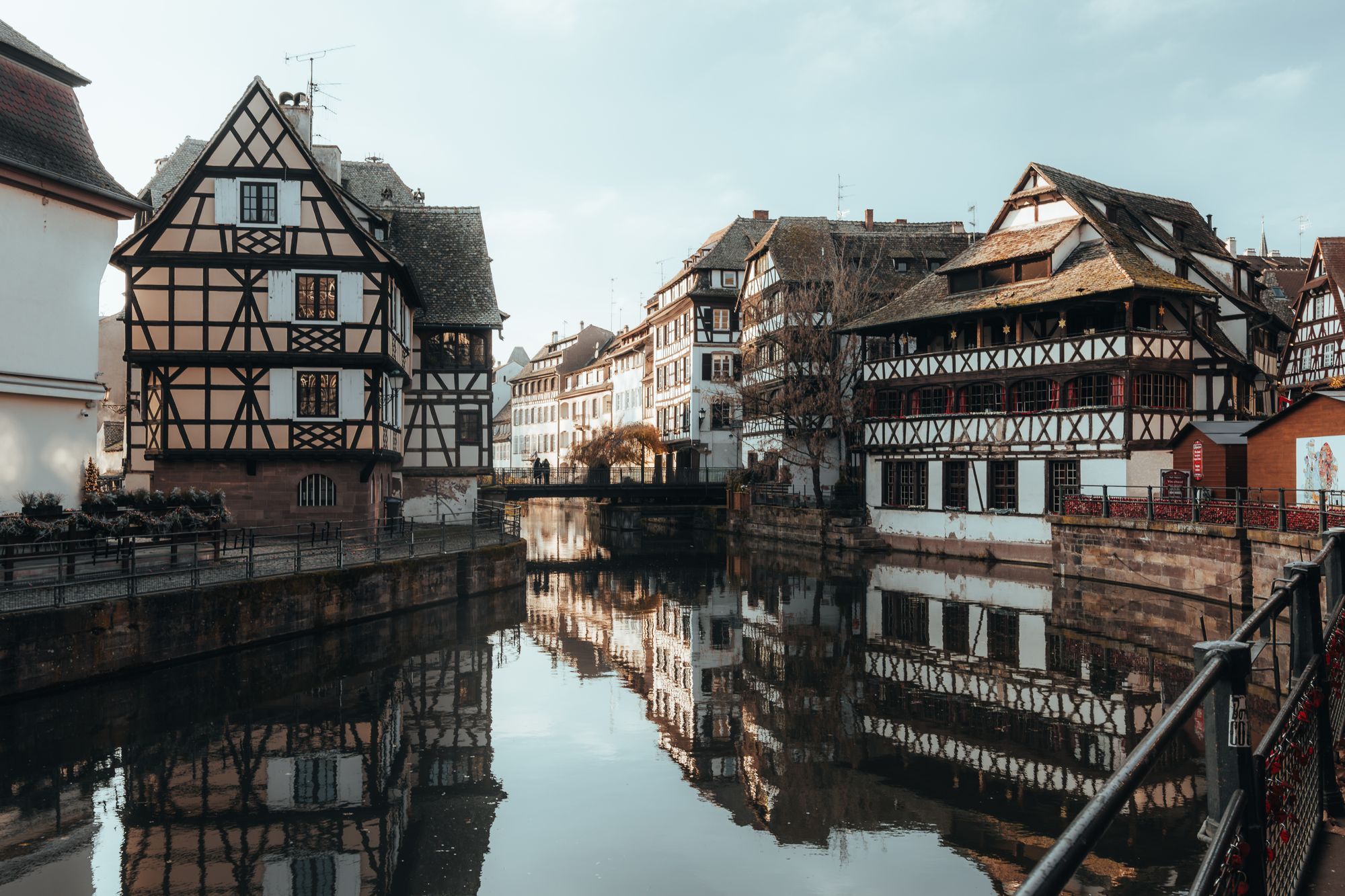 Half-timbered houses reflected in a canal in the Petite France quarter of Strasbourg.