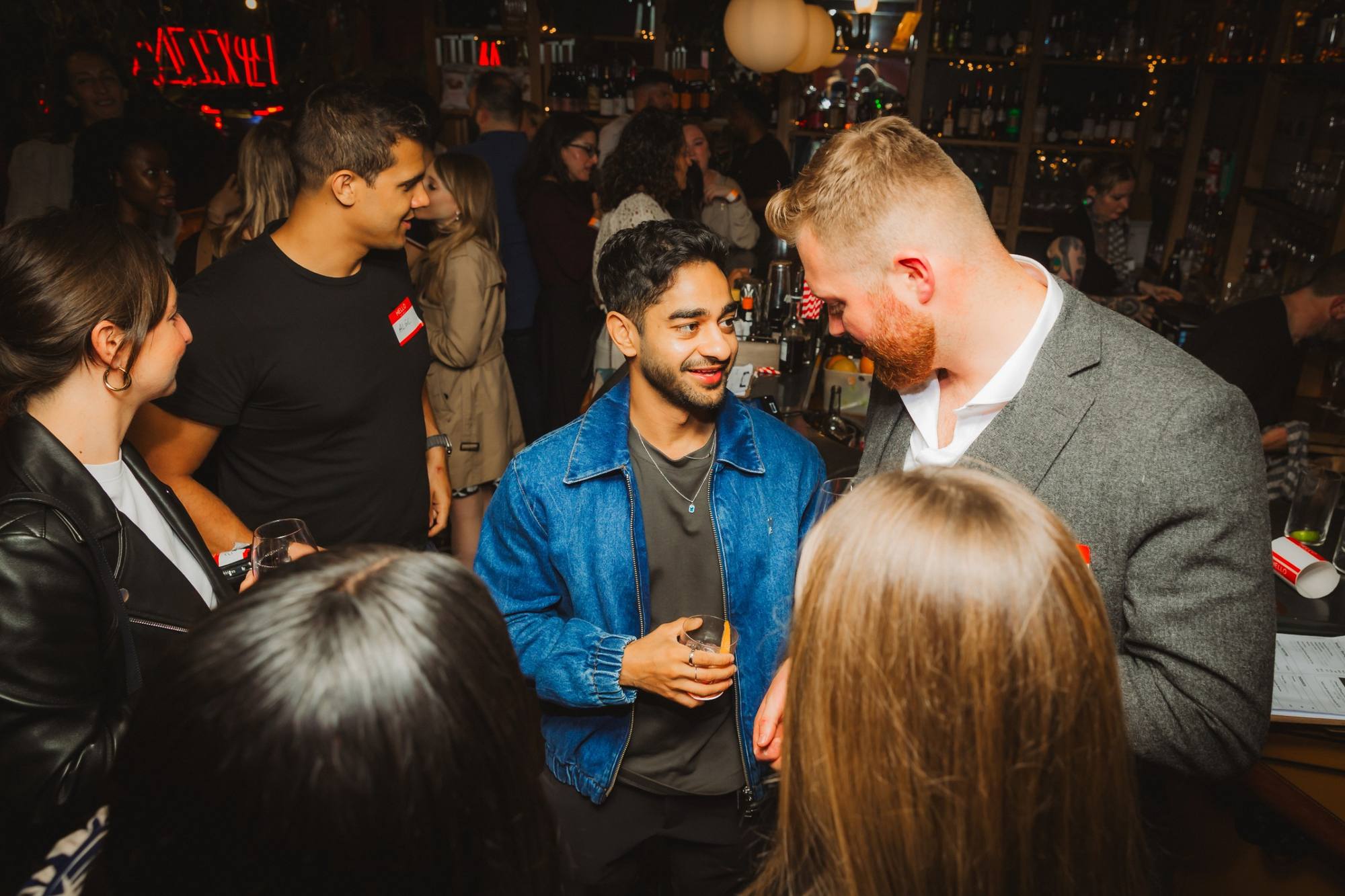 Guests standing and talking at a Timeleft drinks evening