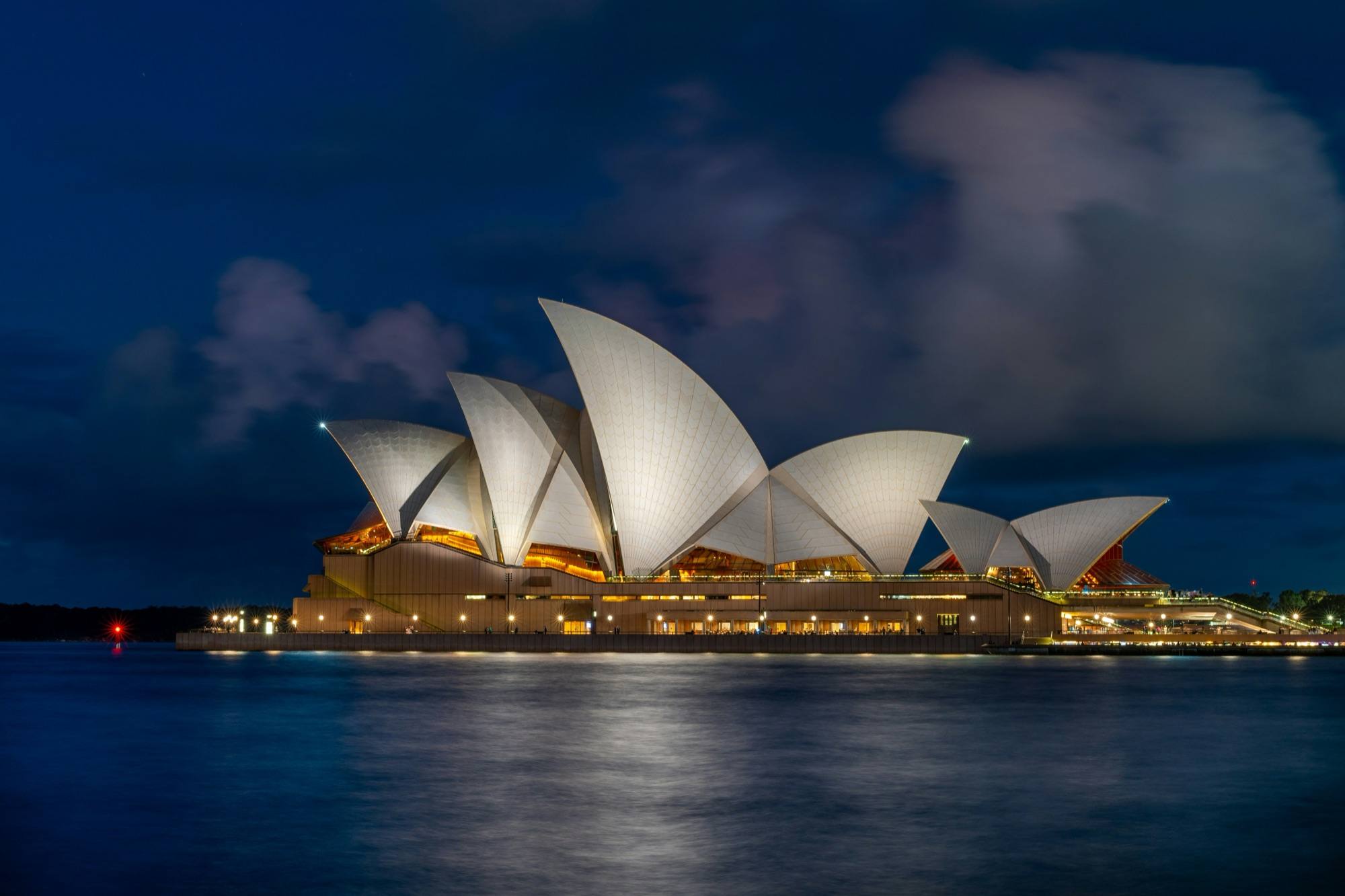 The Sydney Opera House lit up at blue hour