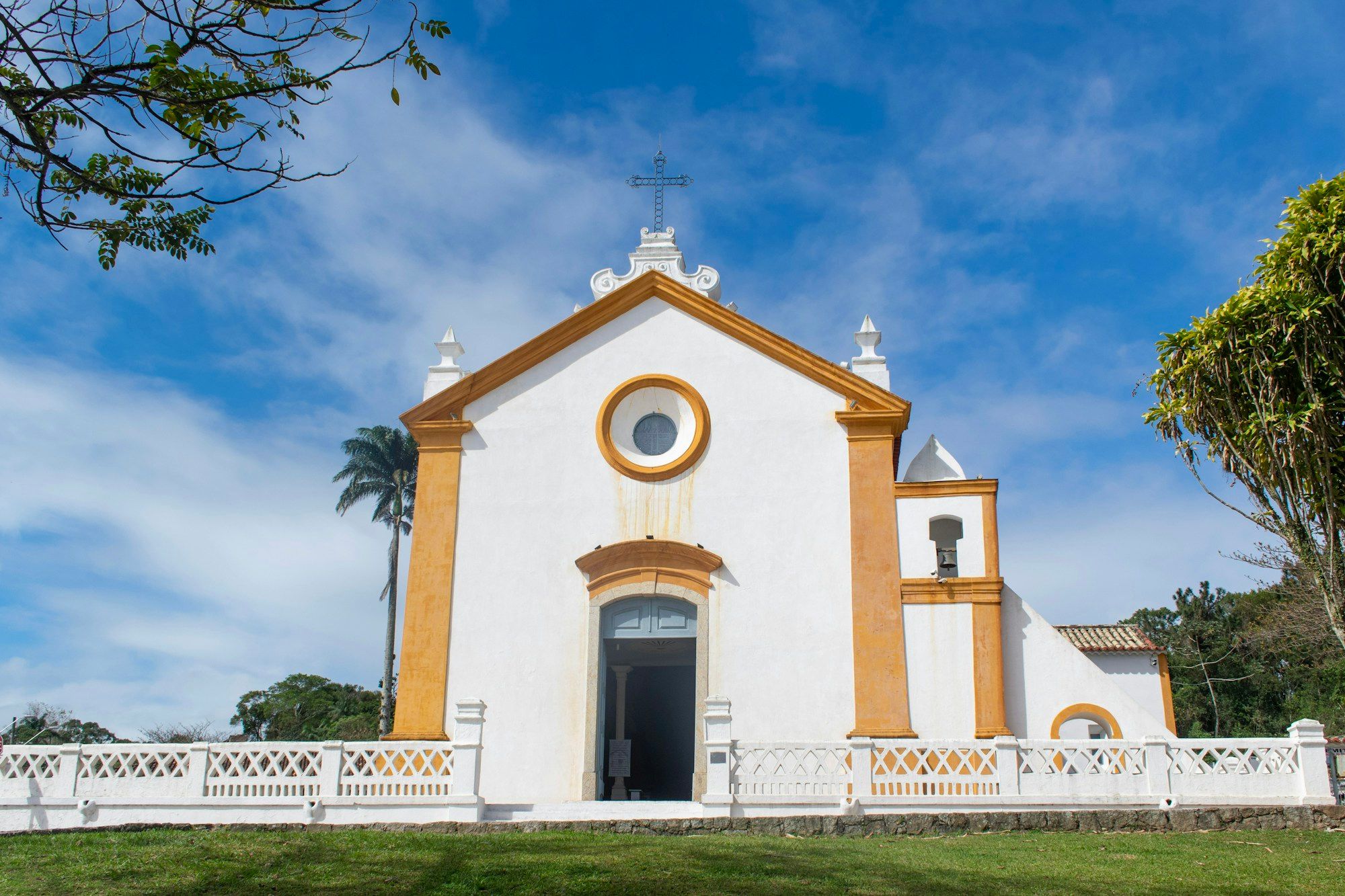 The white and yellow Nossa Senhora das Necessidades church in the village of Santo Antônio de Lisboa, Florianópolis.