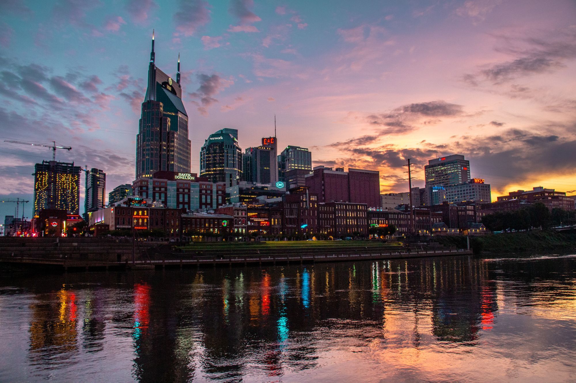 The Nashville skyline at sunset, reflected in the Cumberland River.