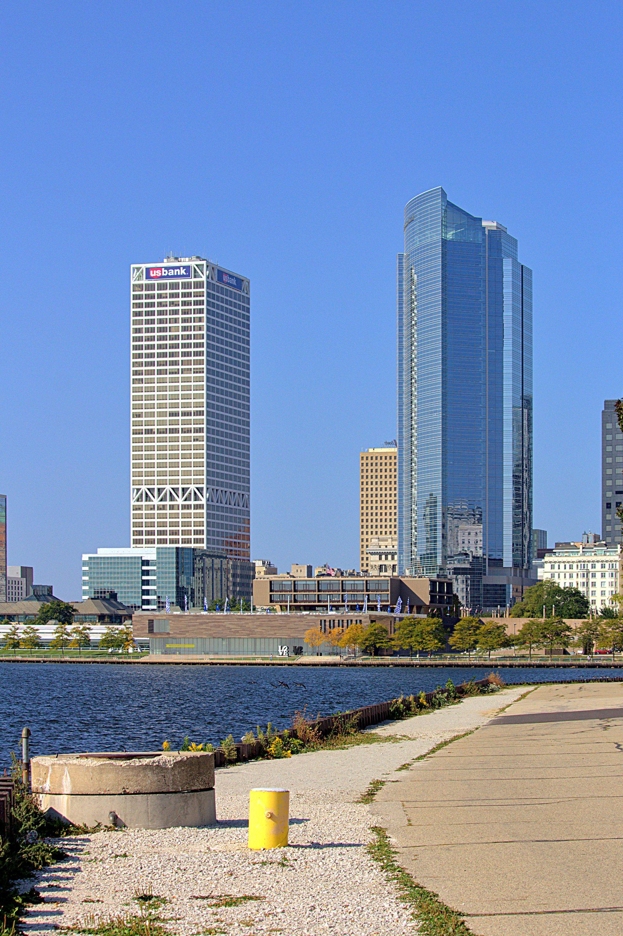 Two downtown Milwaukee towers rising above the lakefront path.
