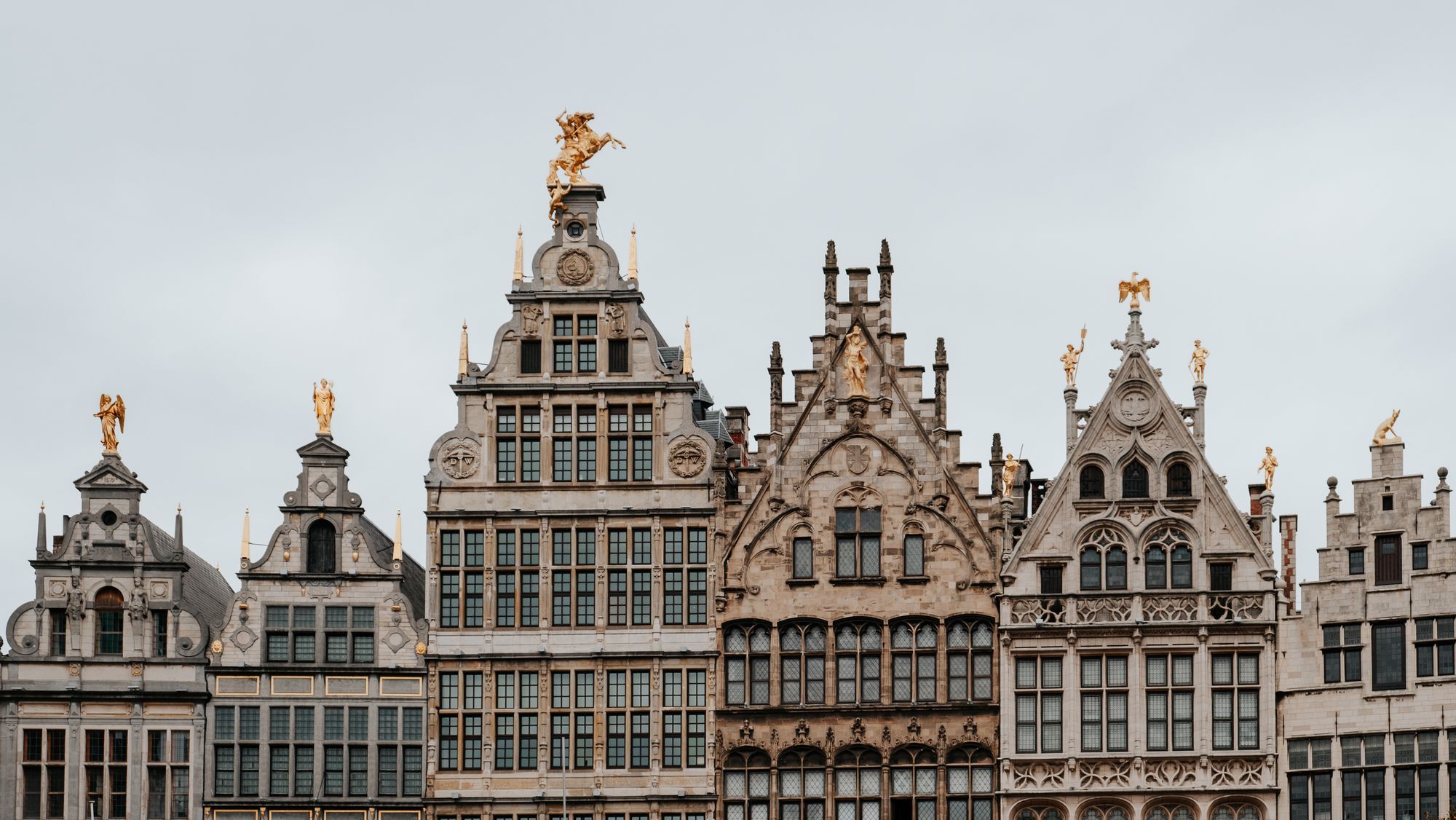 The gabled guild houses on the Grote Markt in Antwerp, with their gilded statues.