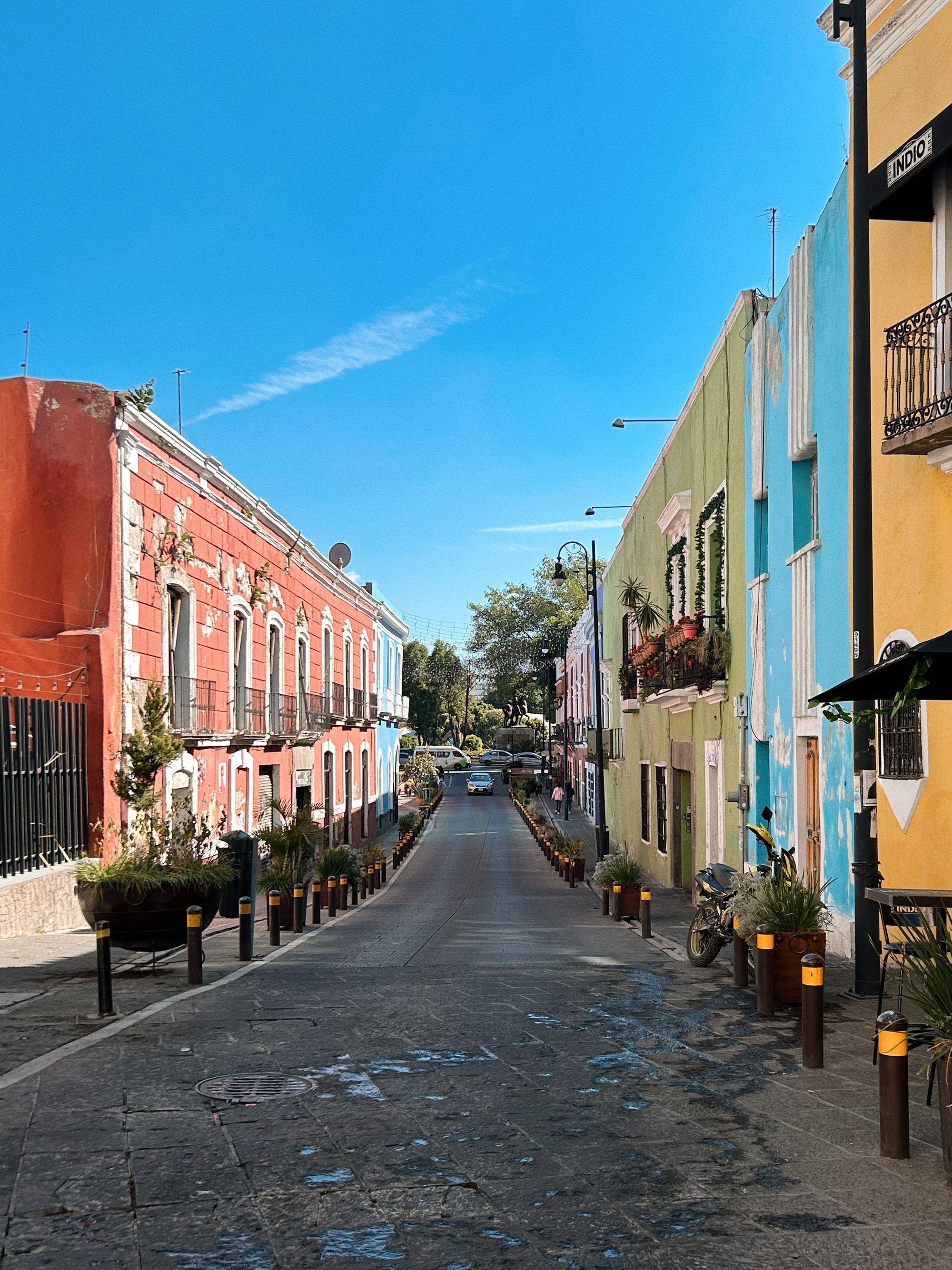A street of colorful colonial houses in the center of Puebla.