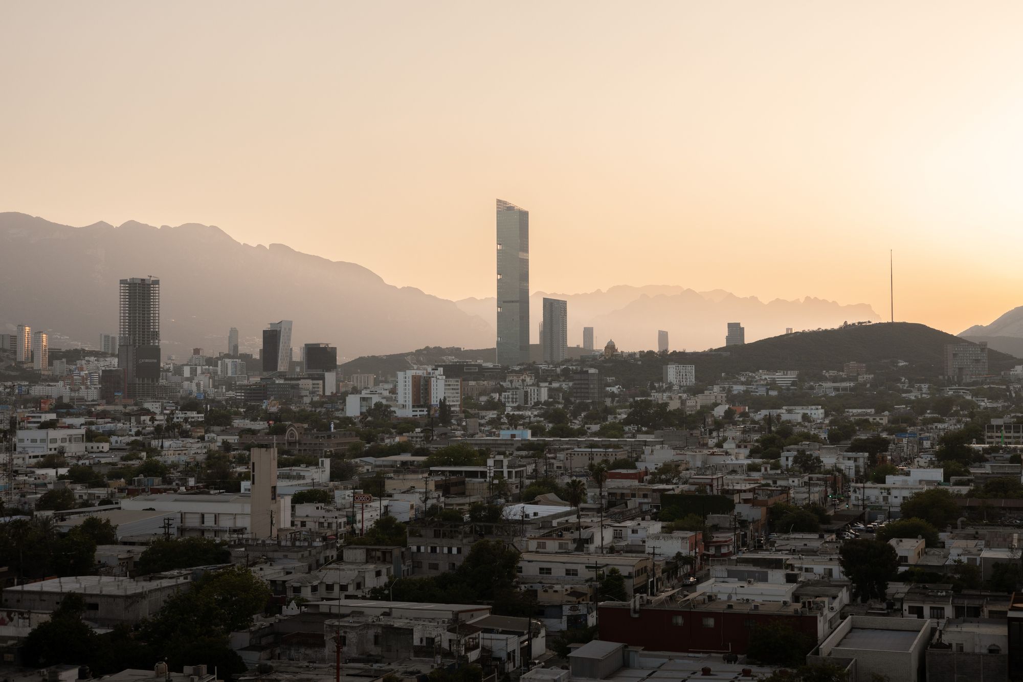 The Monterrey skyline at sunset with the Sierra Madre behind.
