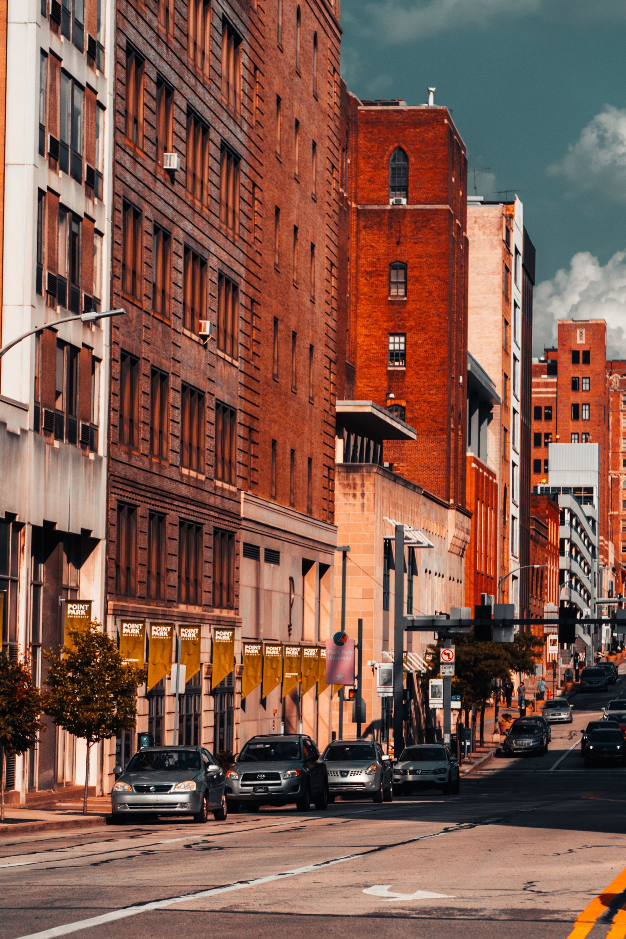 Historic brick buildings along a downtown street in Pittsburgh.