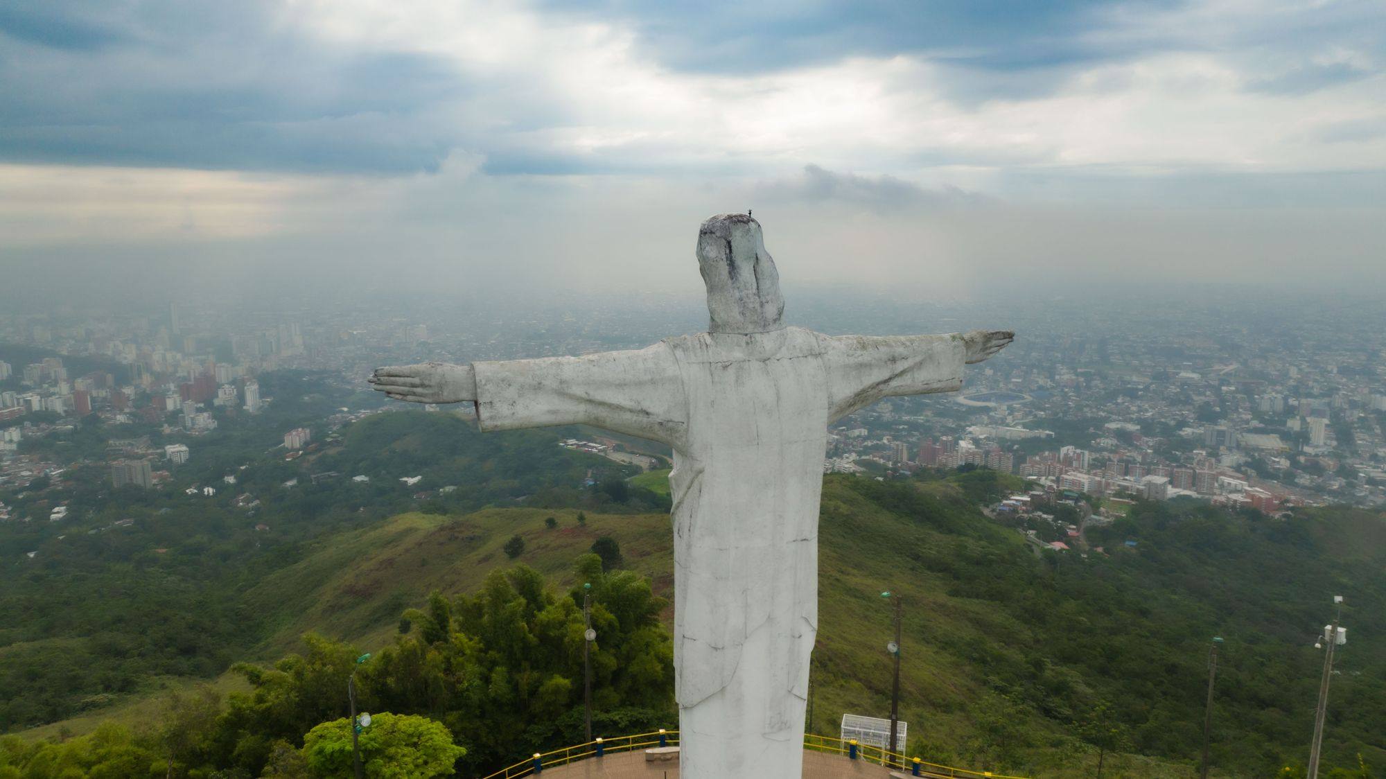 The Cristo Rey statue on its hill above Cali, with the city in the haze behind.