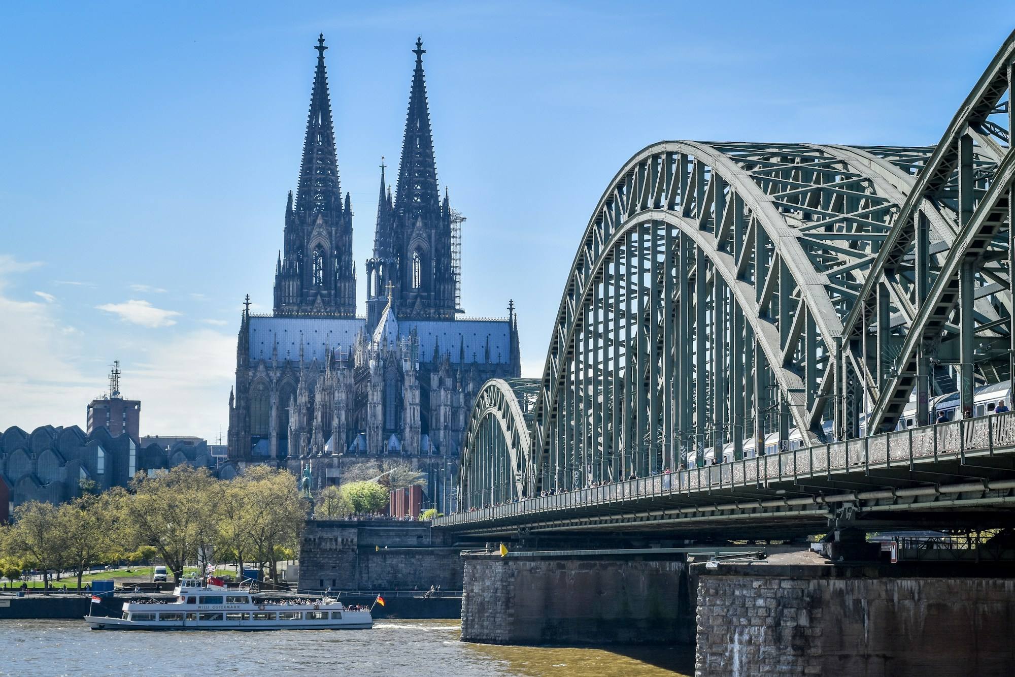 Cologne Cathedral and the Hohenzollern Bridge over the Rhine on a clear day