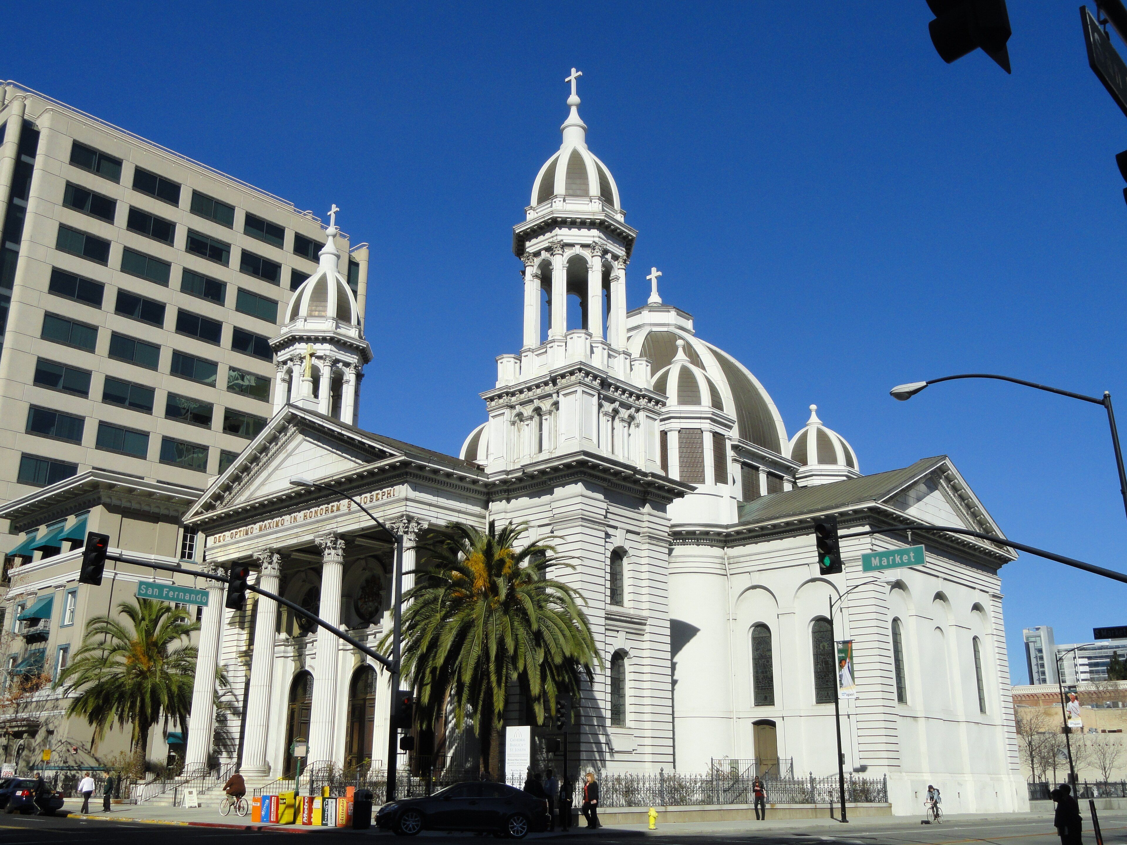 The Cathedral Basilica of St. Joseph with palm trees on Market Street in downtown San Jose.