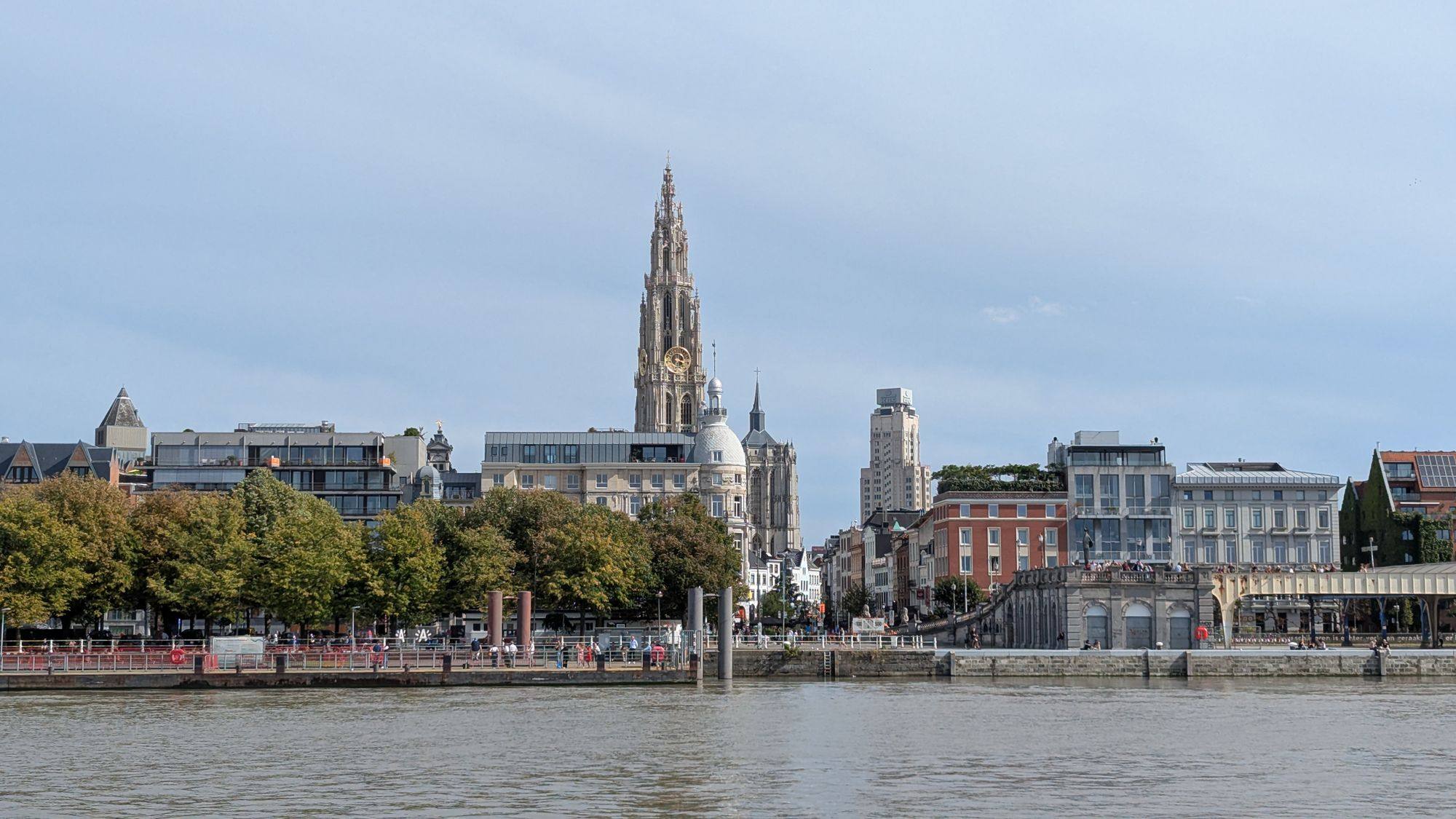 The spire of the Cathedral of Our Lady above the Scheldt waterfront in Antwerp.