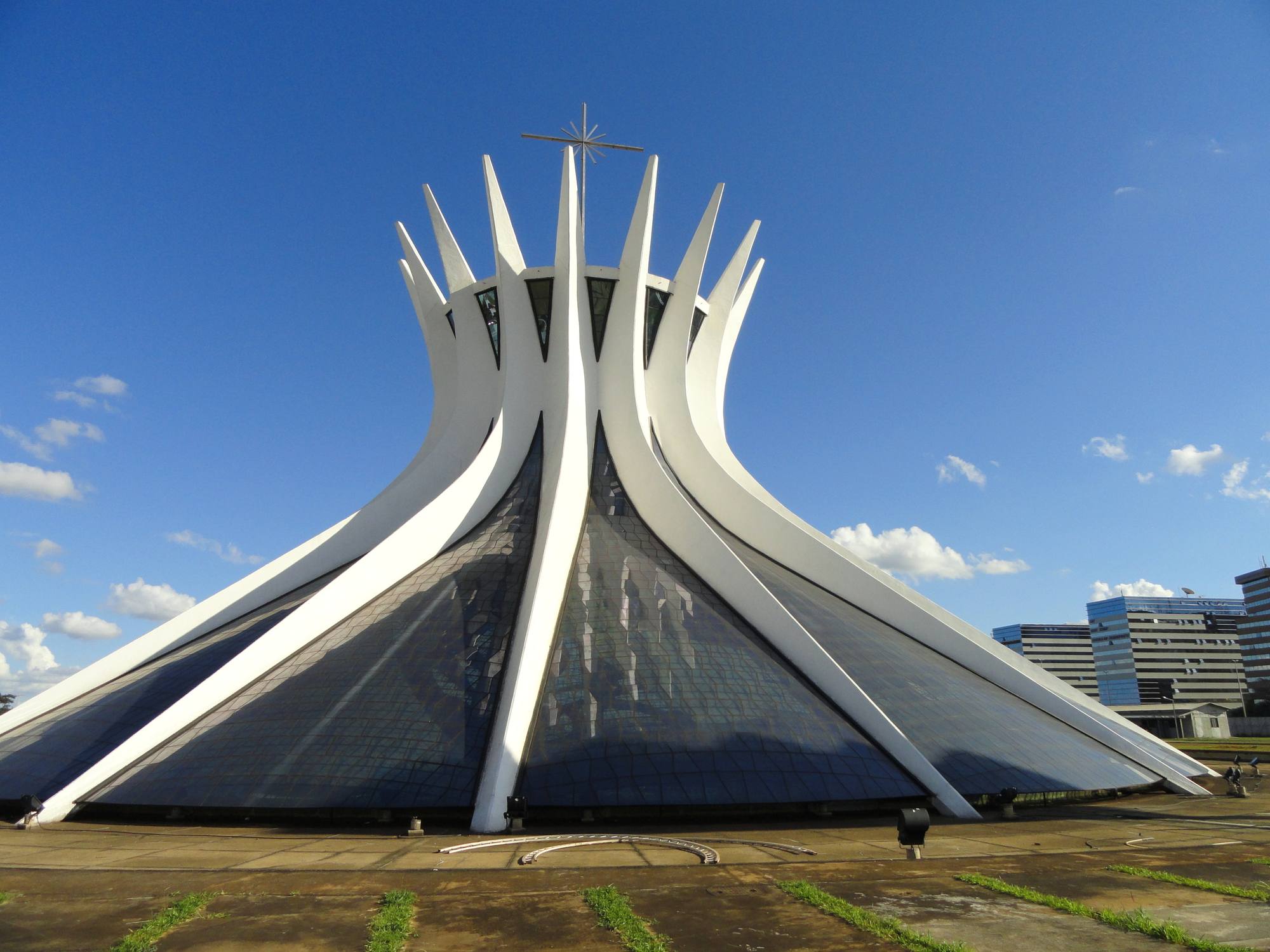 The Cathedral of Brasília by Oscar Niemeyer, its white concrete columns rising against a blue sky.