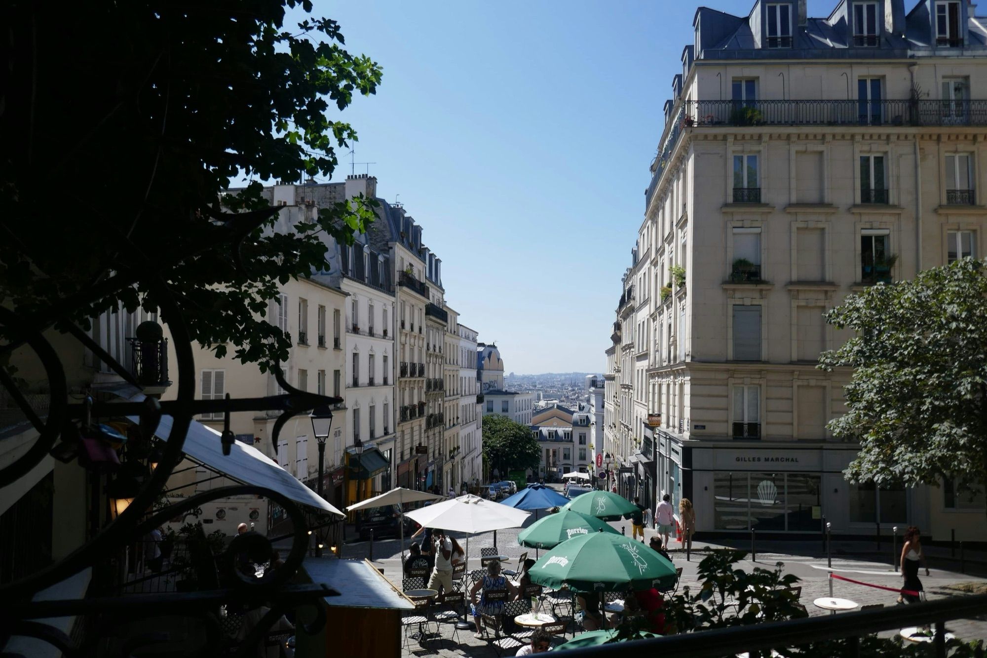 A Montmartre street in Paris lined with café terraces