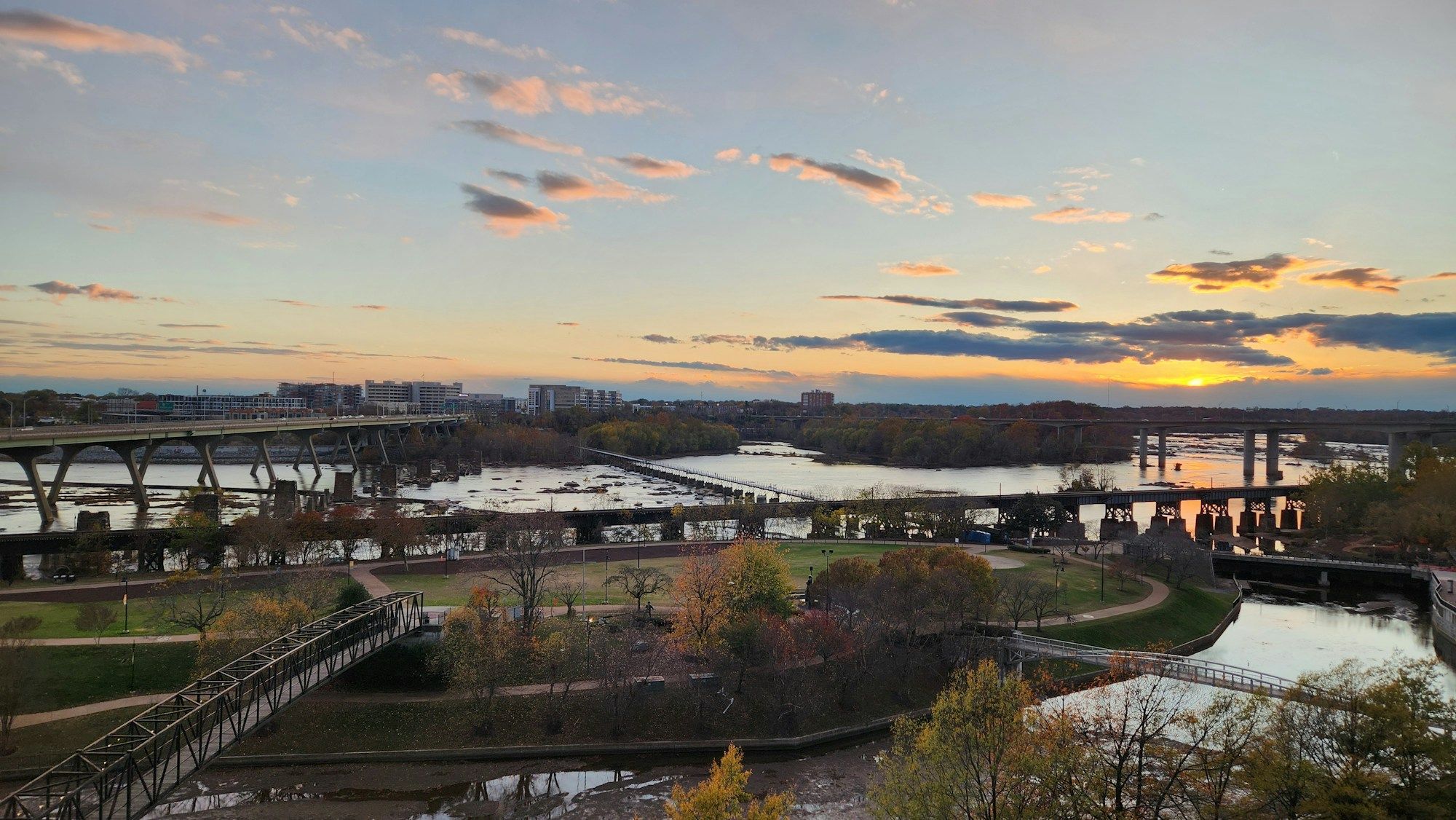 A bridge across the James River in Richmond at sunset