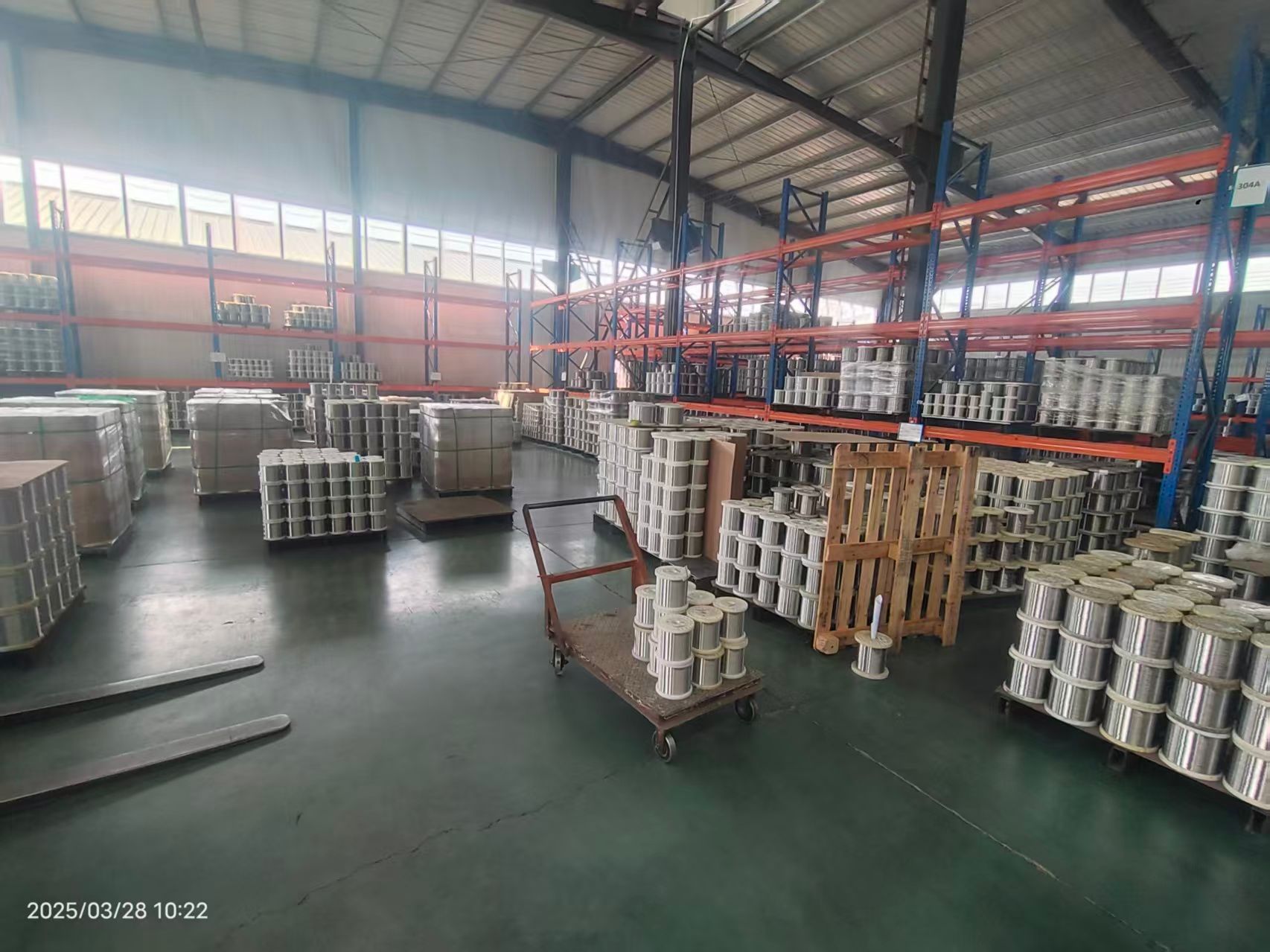 KAIFIL factory workshop with stainless wire spools on storage racks